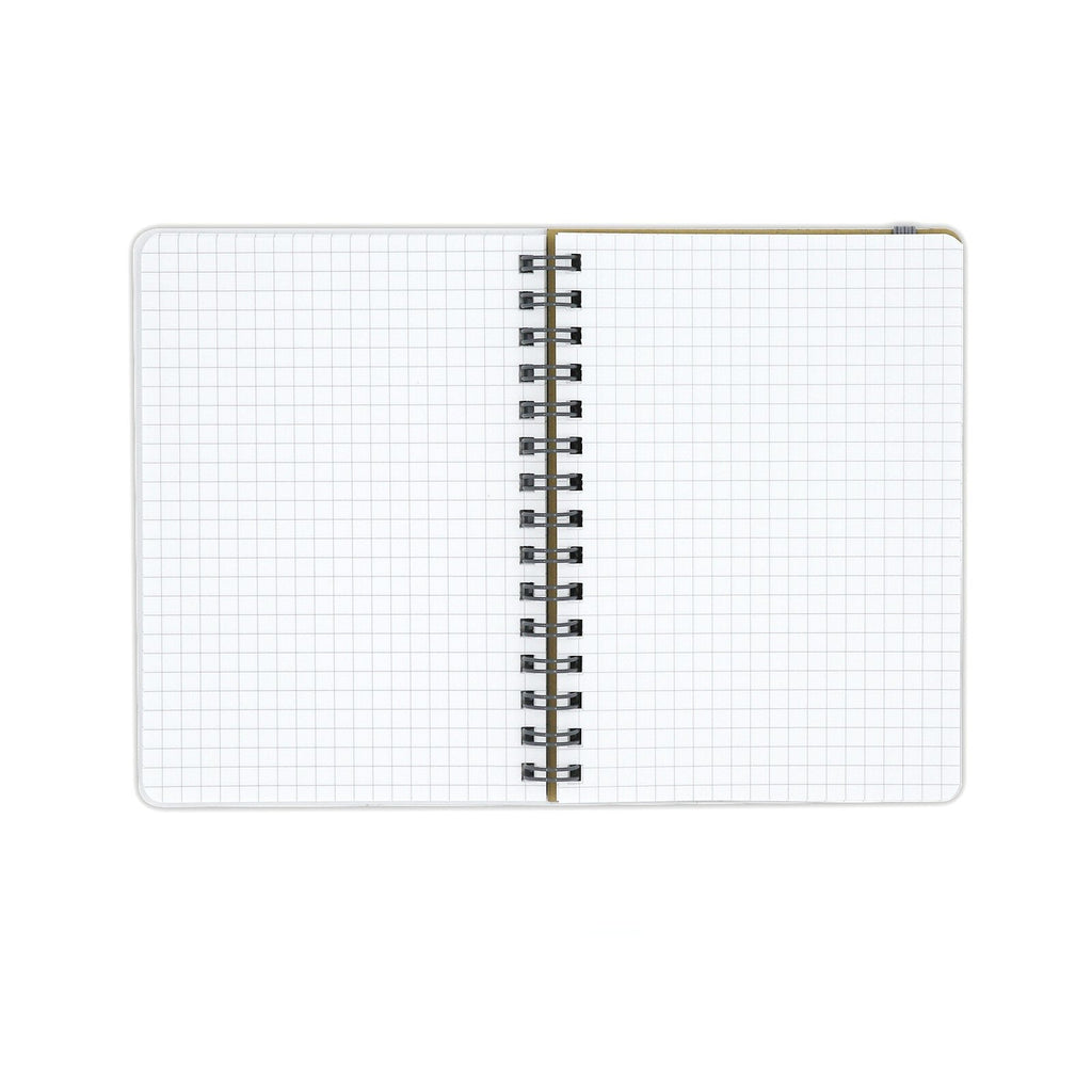 Open A6 notebook showing 5mm square grid pages.
