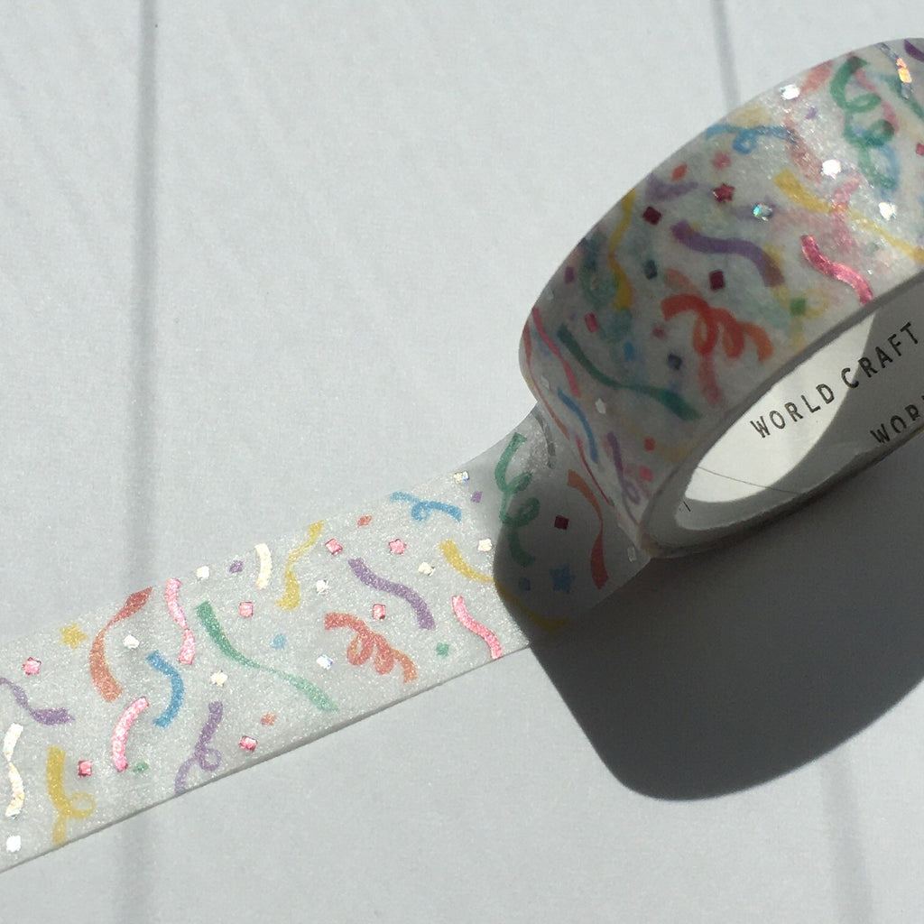 Close-up of glitter masking tape with colourful confetti design and pink and purple foil accents.
