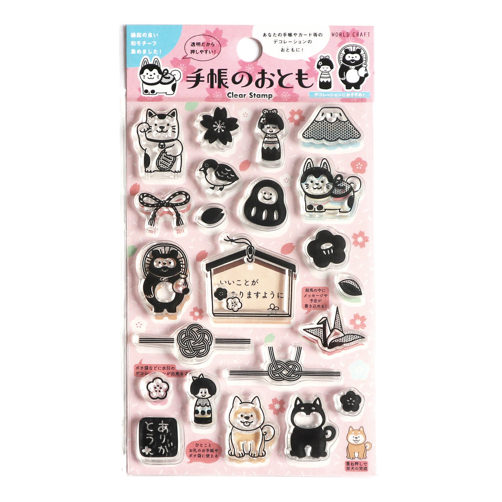 World Craft Clear Stamp Set featuring Japanese motifs including Shiba Inu, cherry blossoms, Daruma, and traditional knot designs.
