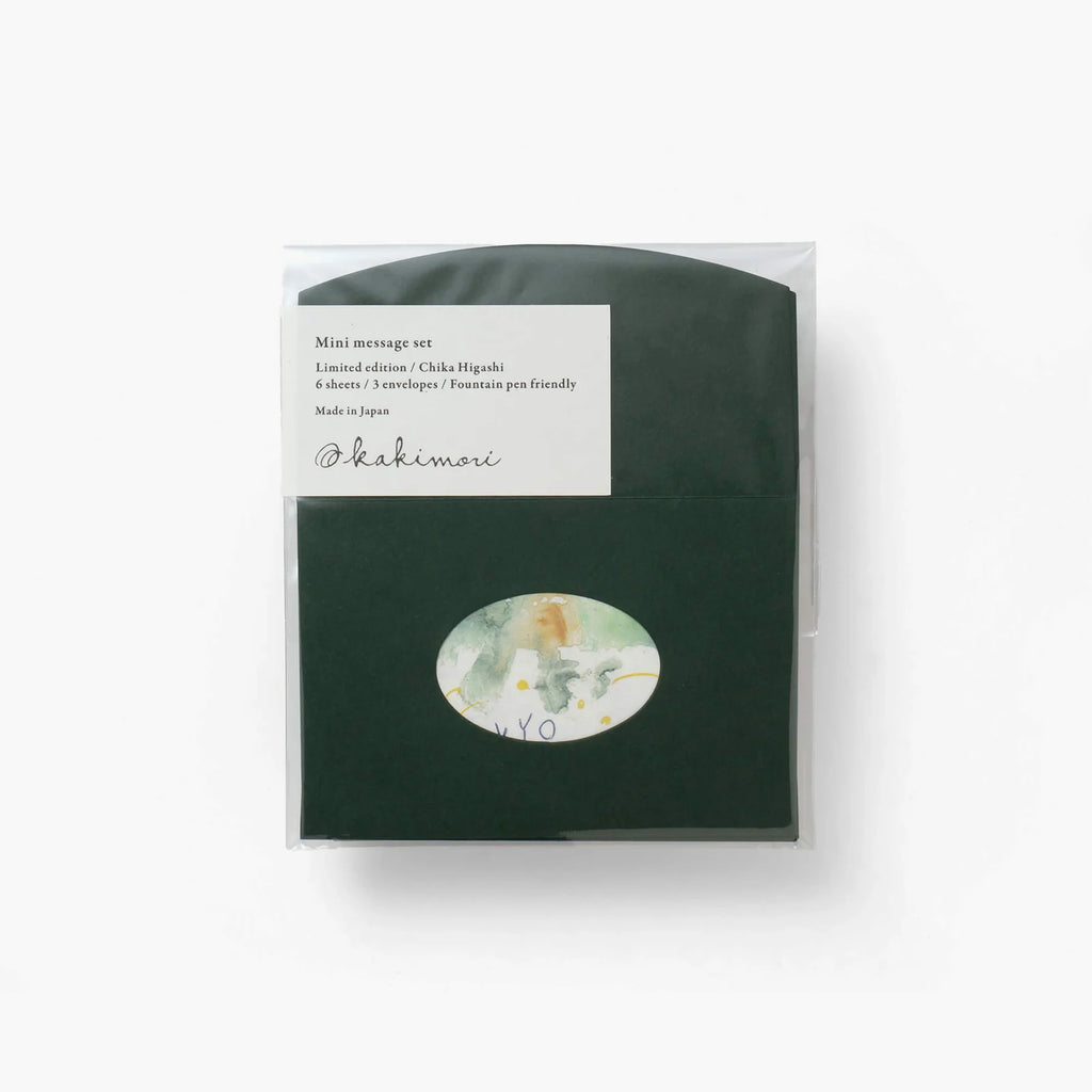 Kakimori mini message set in dark green packaging with abstract 'Rin I' artwork visible through an oval window.