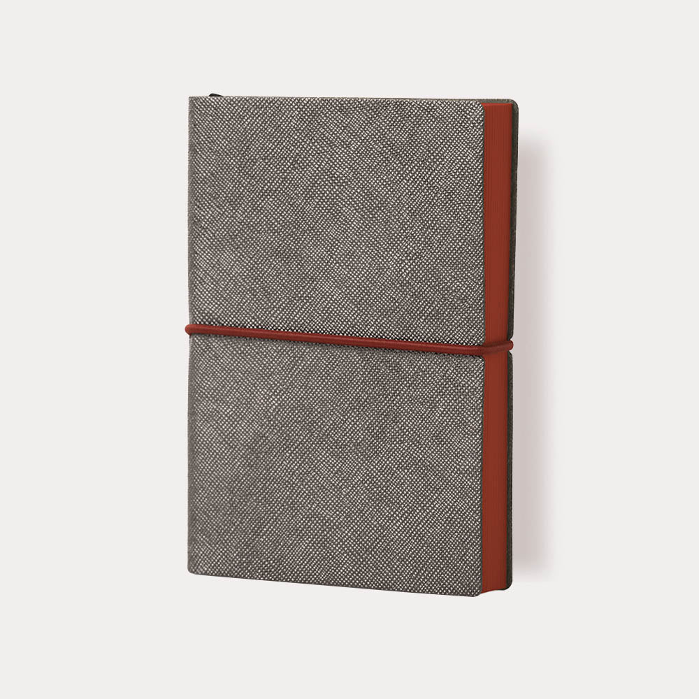 Ciak Plus Pocket Notebook with Saffiano-textured cover and horizontal elastic closure.
