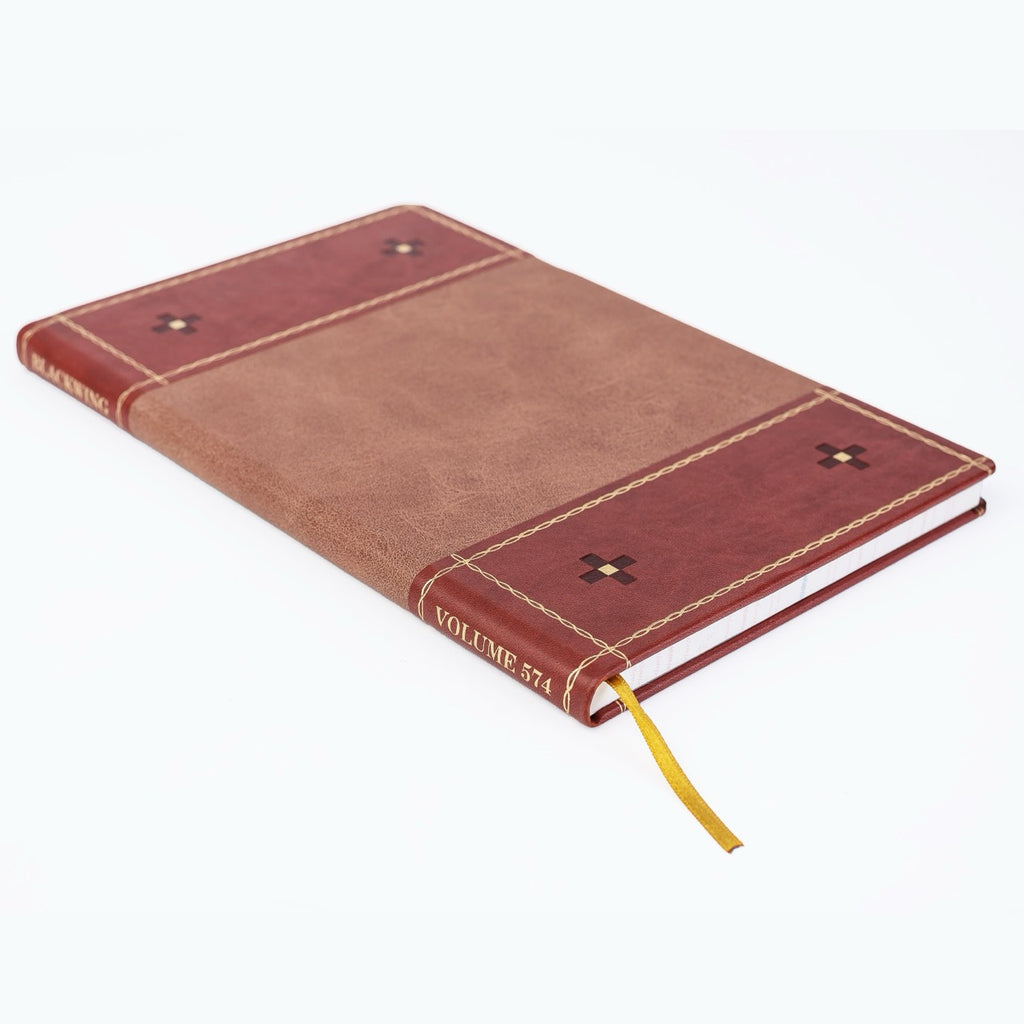 Blackwing Volume 574 ledger book with vegan leather and suede cover on white background.
