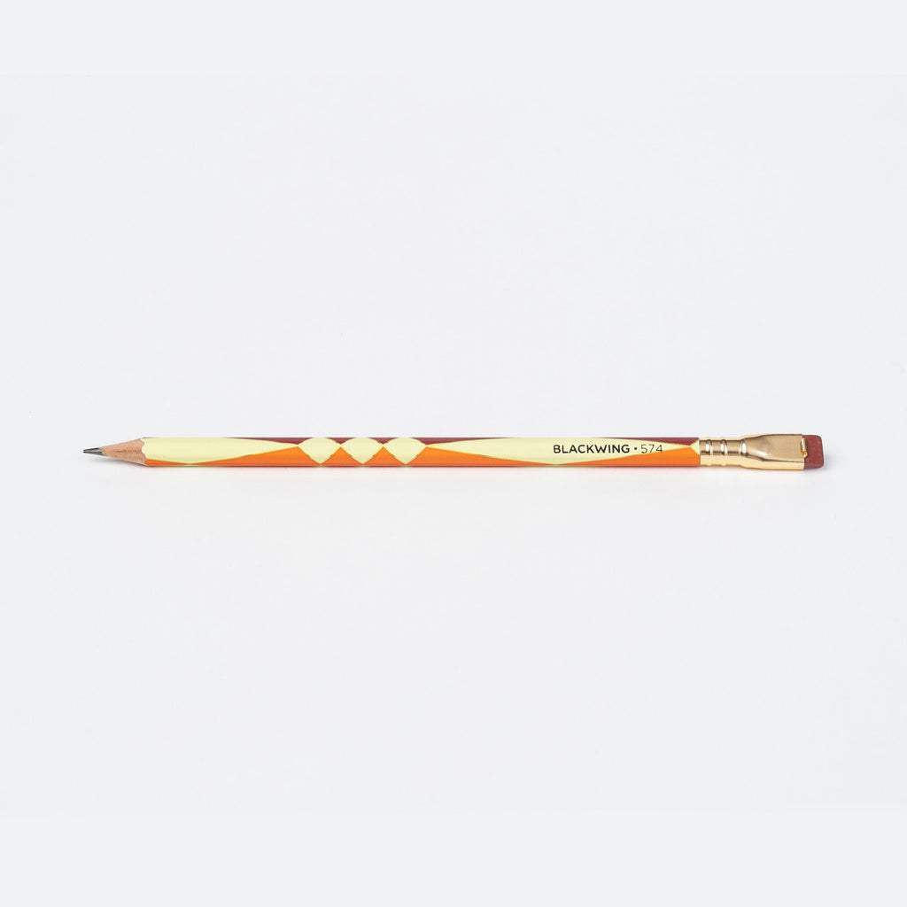 Single Blackwing Volume 574 pencil with geometric patterns and gold ferrule.
