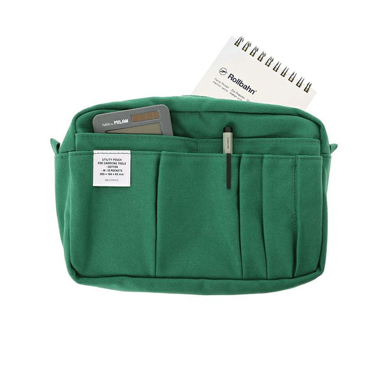 Green Delfonics Inner Carrying Utility Pouch M packed with stationery and work essentials.
