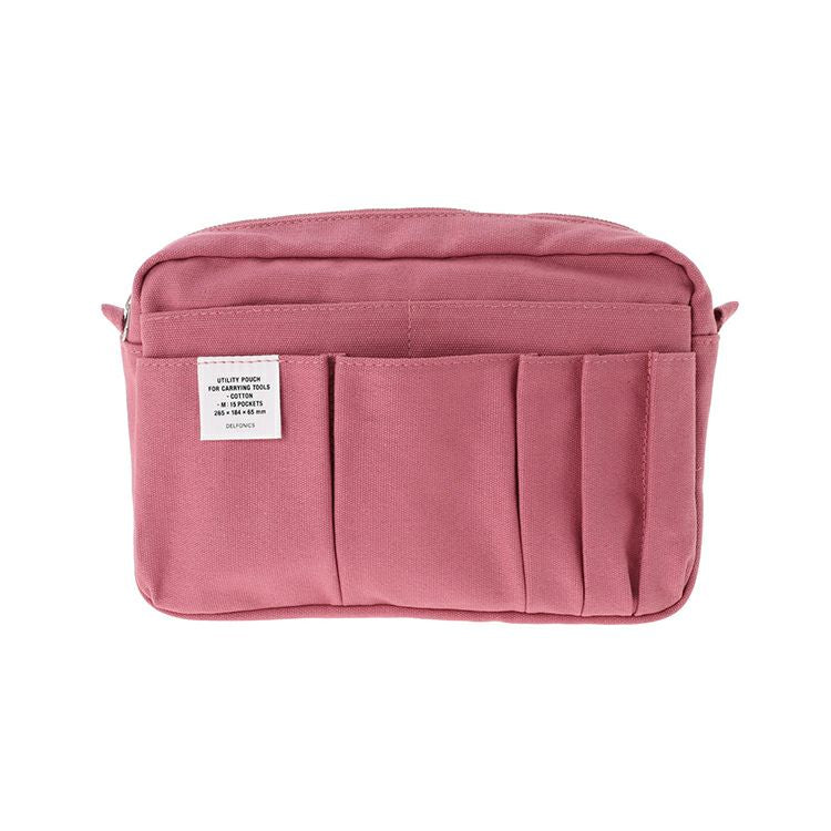 Pink Delfonics Inner Carrying Utility Pouch M with a soft, muted tone and spacious storage.
